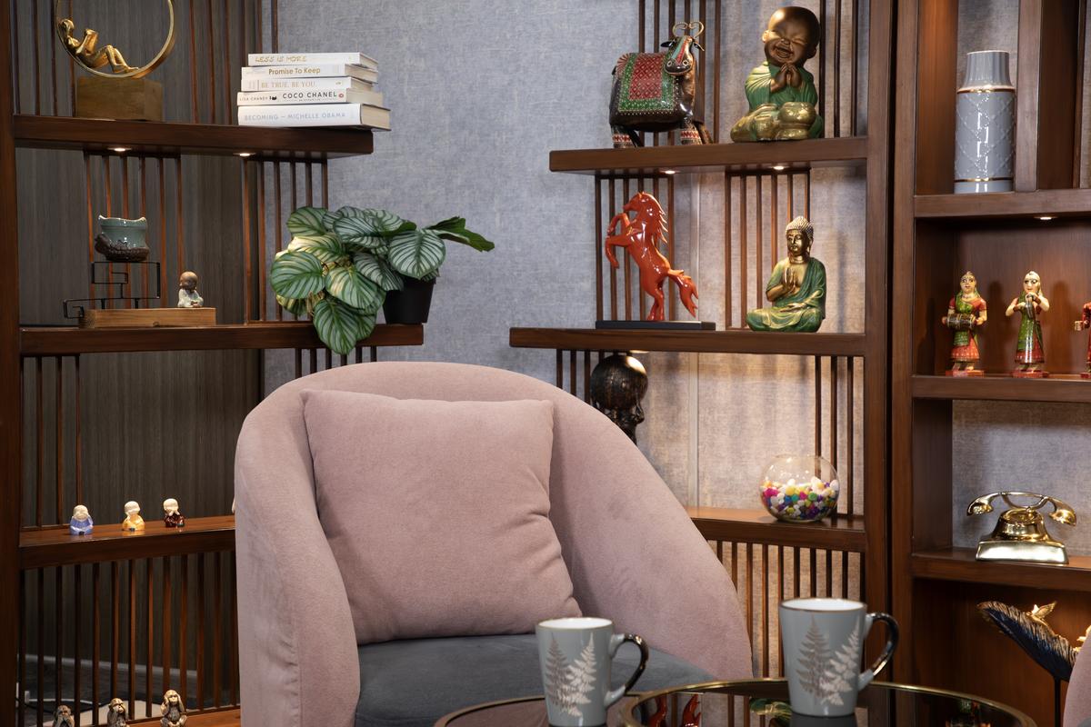 Content Studio OTS shot — over-the-shoulder camera angle showing podcast guest, professional lighting, Gurugram studio