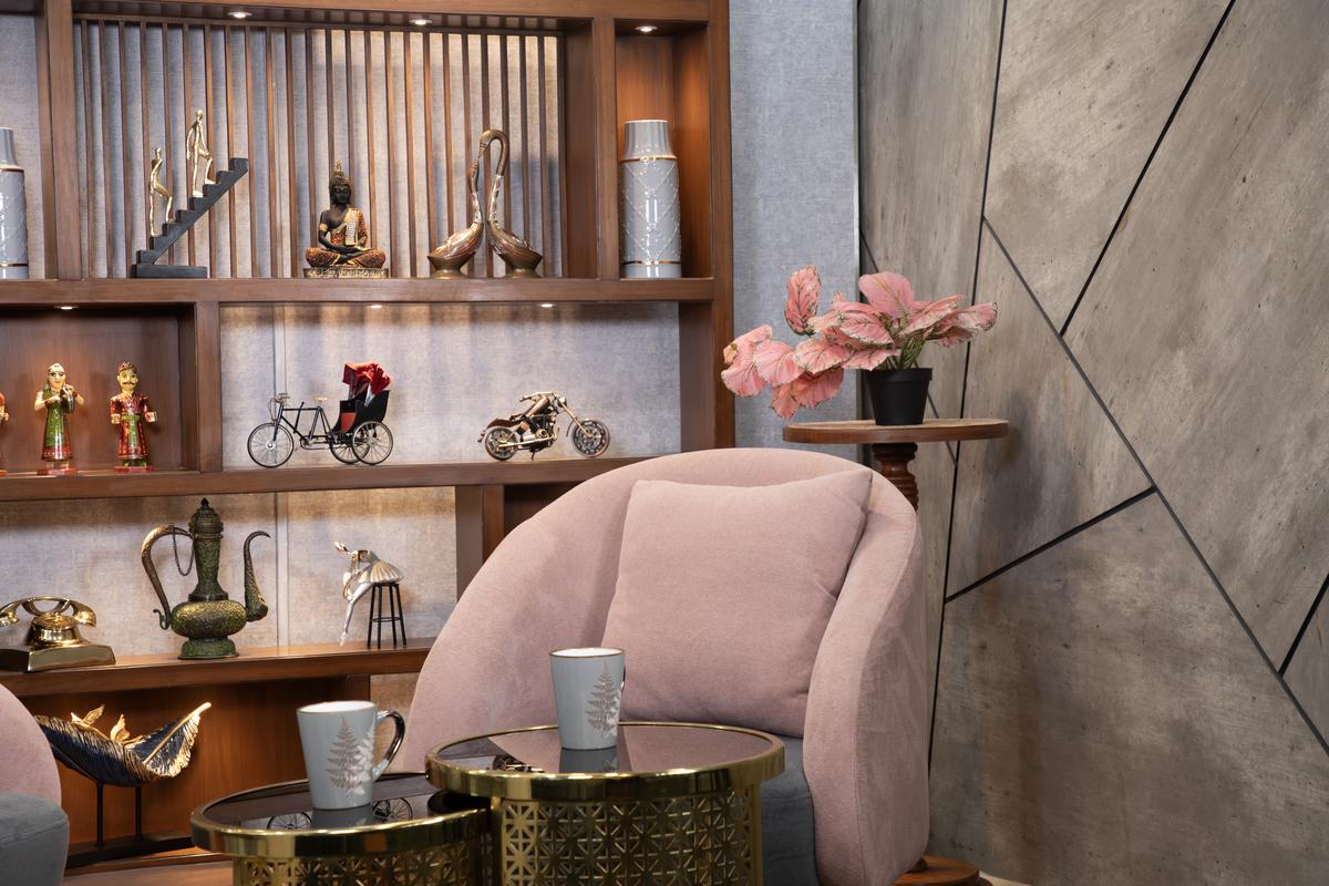 Content Studio OTS shot — over-the-shoulder camera angle showing podcast host, three-camera production, Gurugram studio